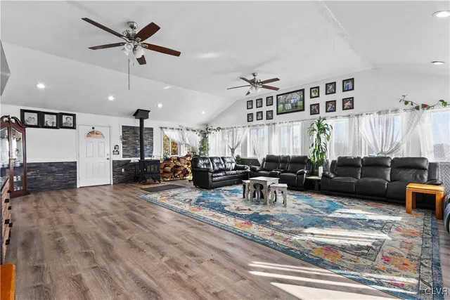 a bathroom with a sink shower and mirror