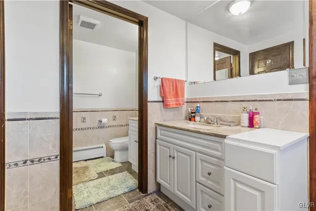 a front view of a house with a yard and a garage