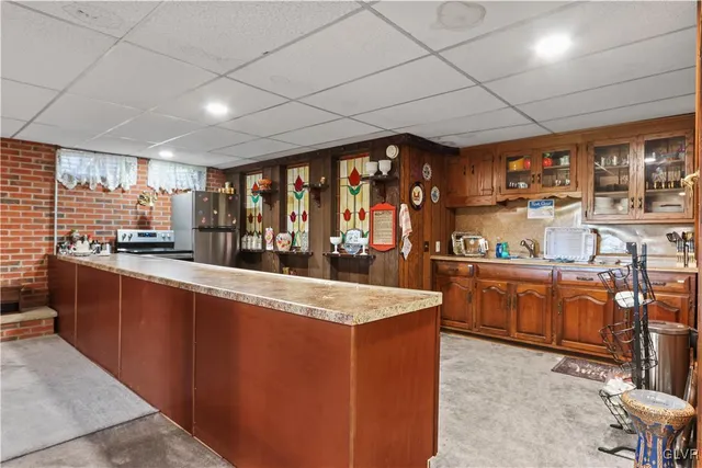 an aerial view of a house with swimming pool and ocean view