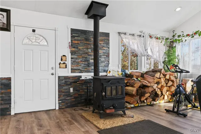 a living room with furniture a rug and a flat screen tv