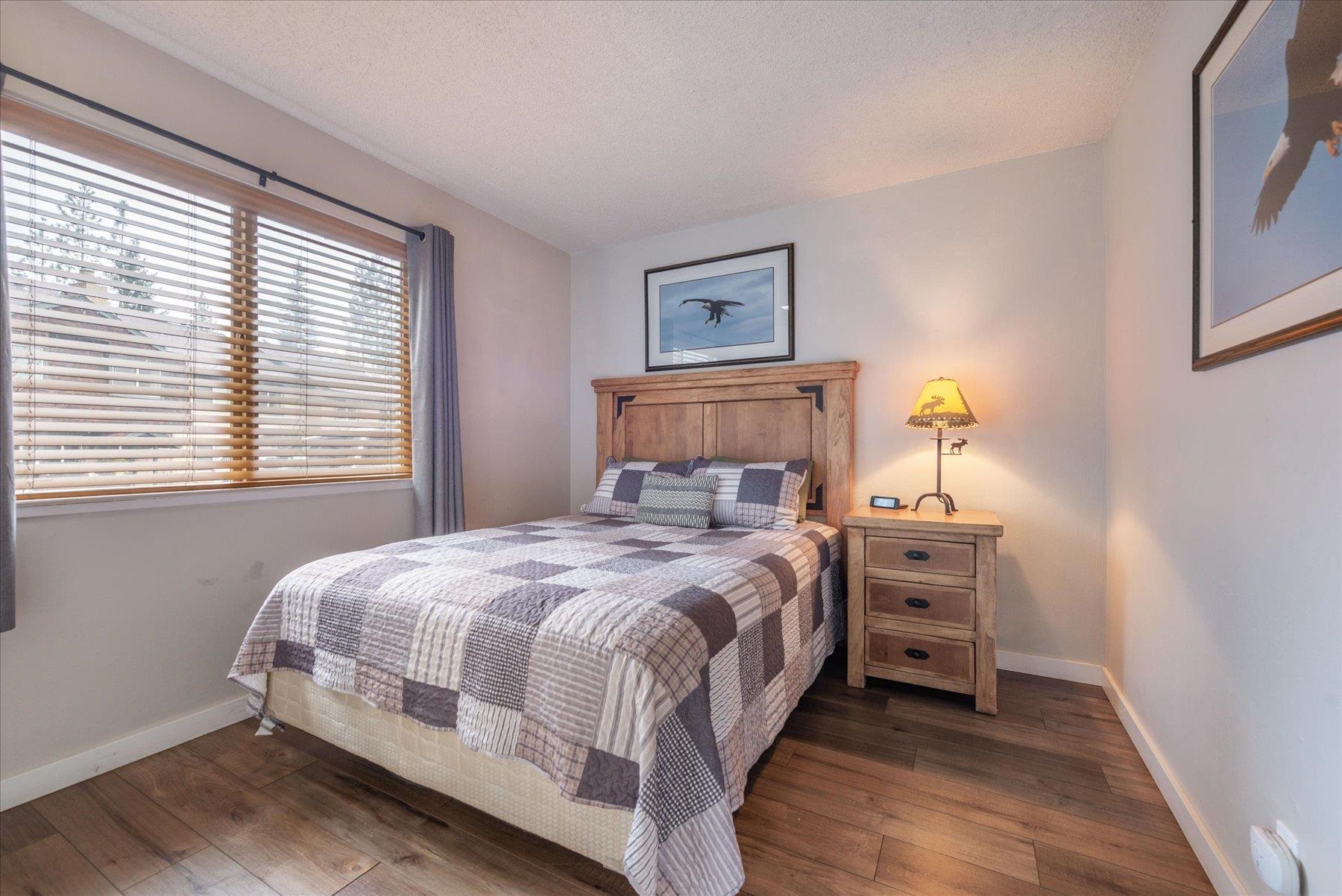 3101 Lake Forest Road, Unit 26 Tahoe City, CA 96145 - Photo 21 of 27 a bedroom with a bed and a window