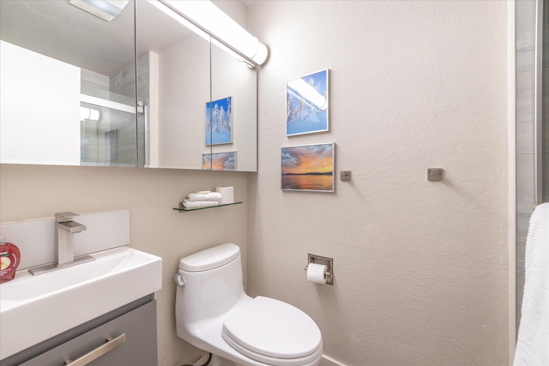 3101 Lake Forest Road, Unit 26 Tahoe City, CA 96145 - Photo 22 of 27 a white toilet sitting next to a bathroom sink