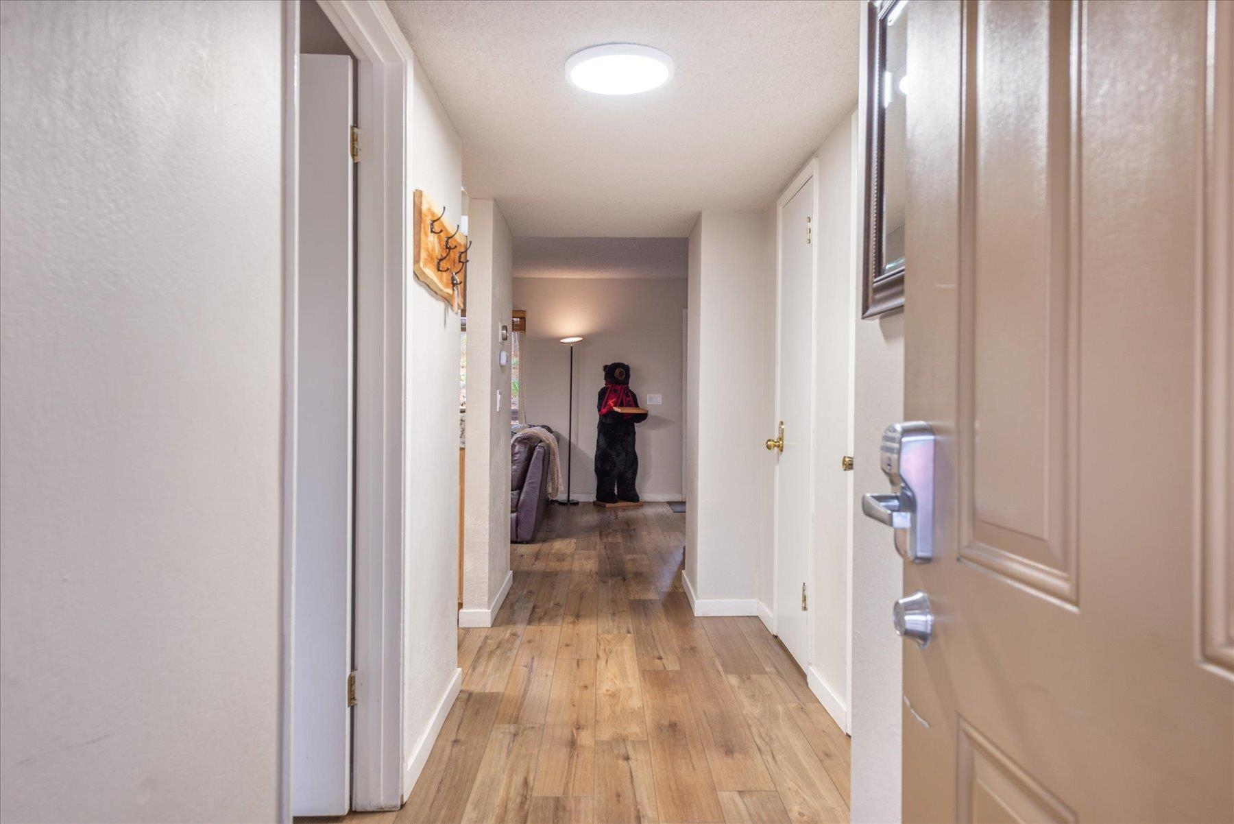 3101 Lake Forest Road, Unit 26 Tahoe City, CA 96145 - Photo 7 of 27 a view of a hallway with wooden floor