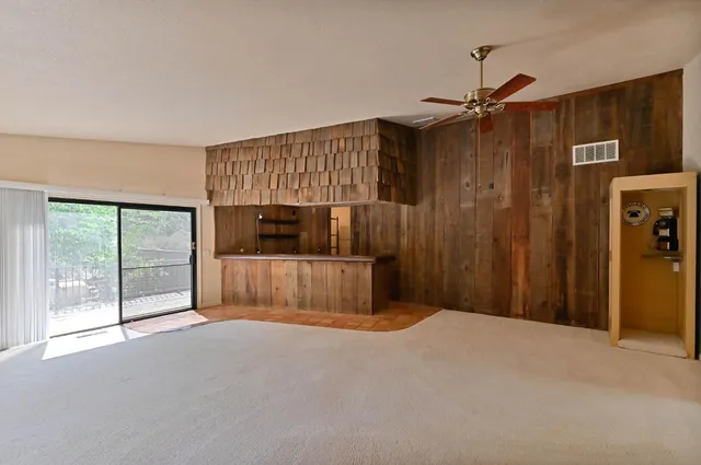 a bathroom with a double vanity sink mirror and shower