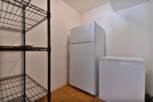 a view of a kitchen with a stove cabinets and wooden floor