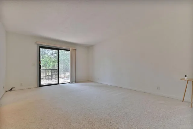 a kitchen with stainless steel appliances wooden floors and wooden cabinets