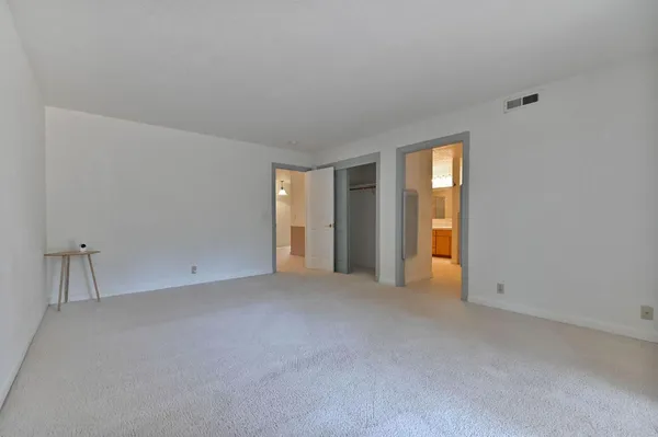 a kitchen with stainless steel appliances a stove sink and microwave