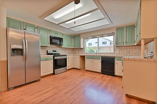 a bathroom with a sink double vanity and a mirror