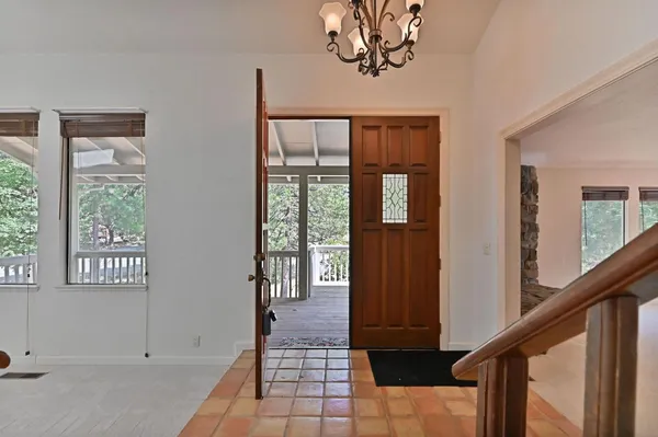 a view of an empty room with stairs