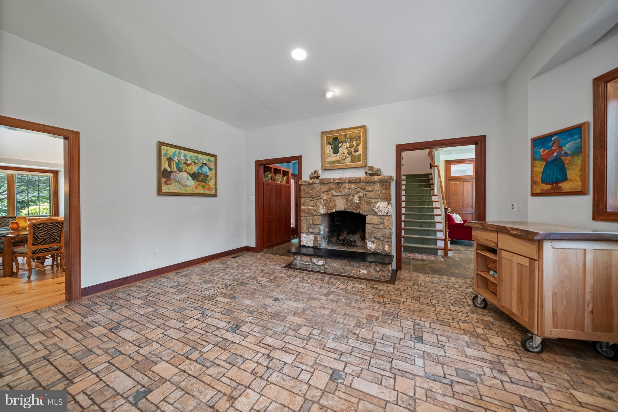 228 Berkley Road Devon, PA 19333 - Photo 12 of 44 BREAKFAST RM. W/STONE FIREPLACE, COZY!