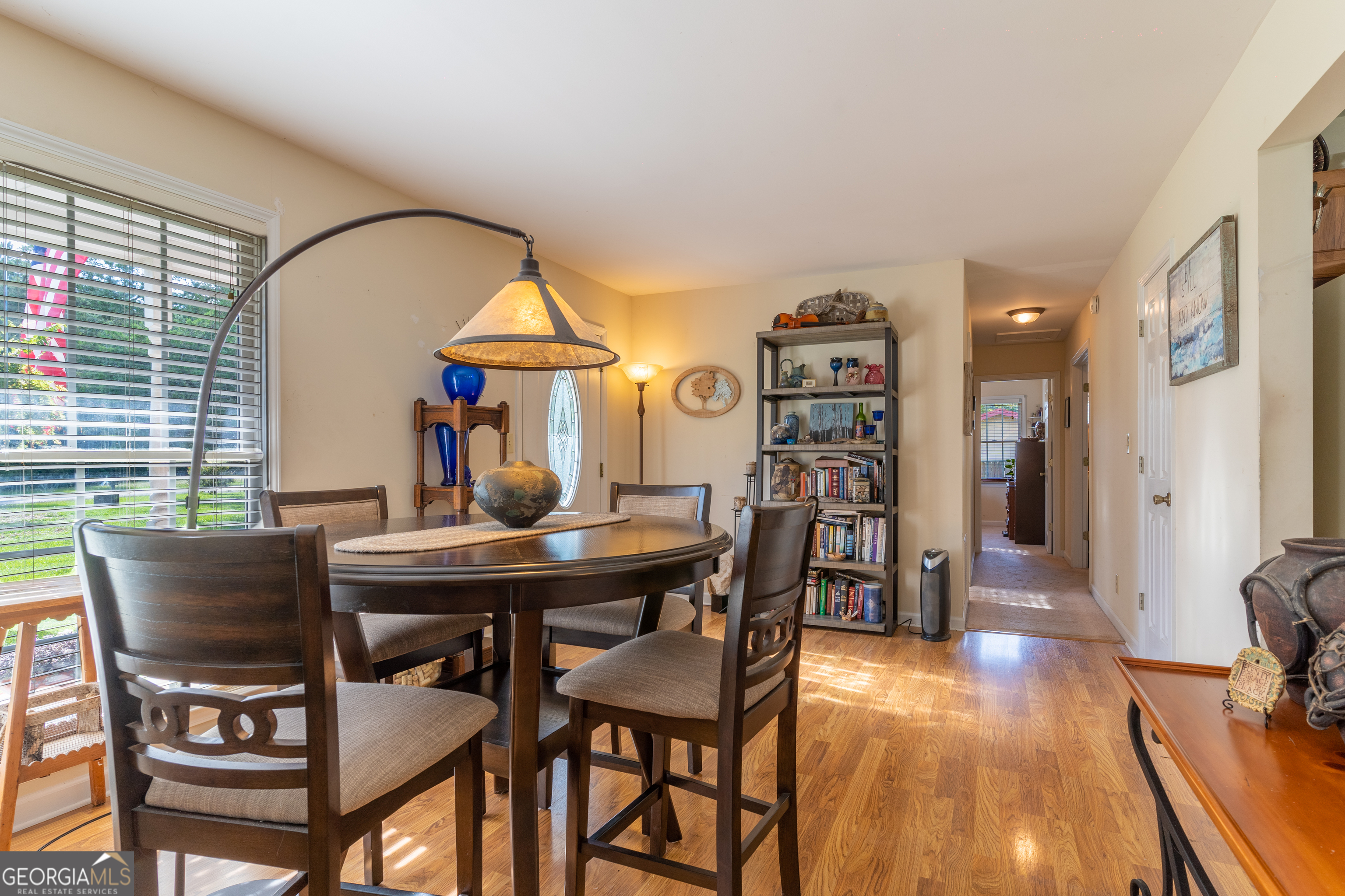 1537 Jackson Street Locust Grove, GA 30248 - Photo 12 of 41 a view of a dining room with furniture and wooden floor