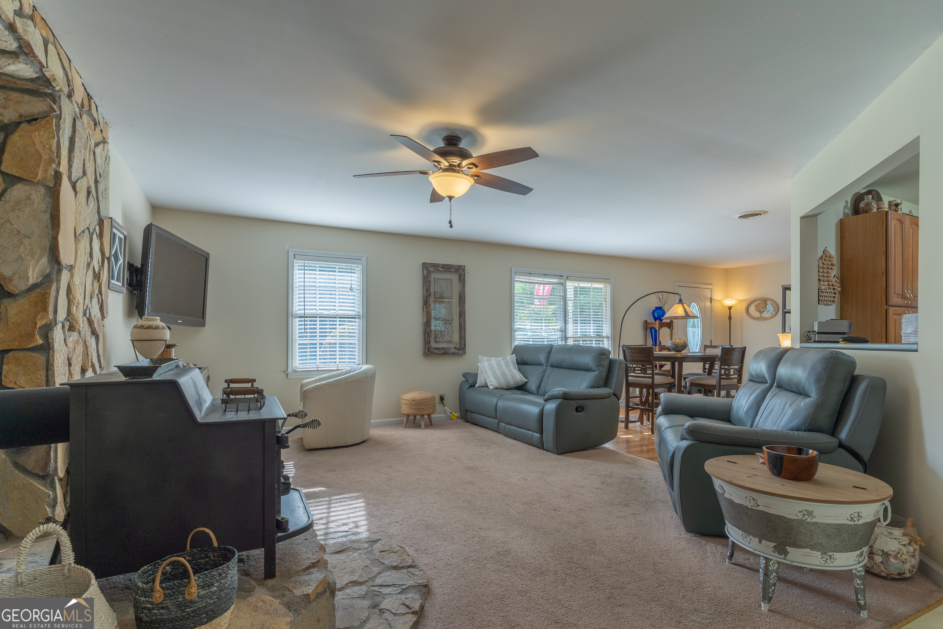1537 Jackson Street Locust Grove, GA 30248 - Photo 13 of 41 a living room with furniture and a flat screen tv