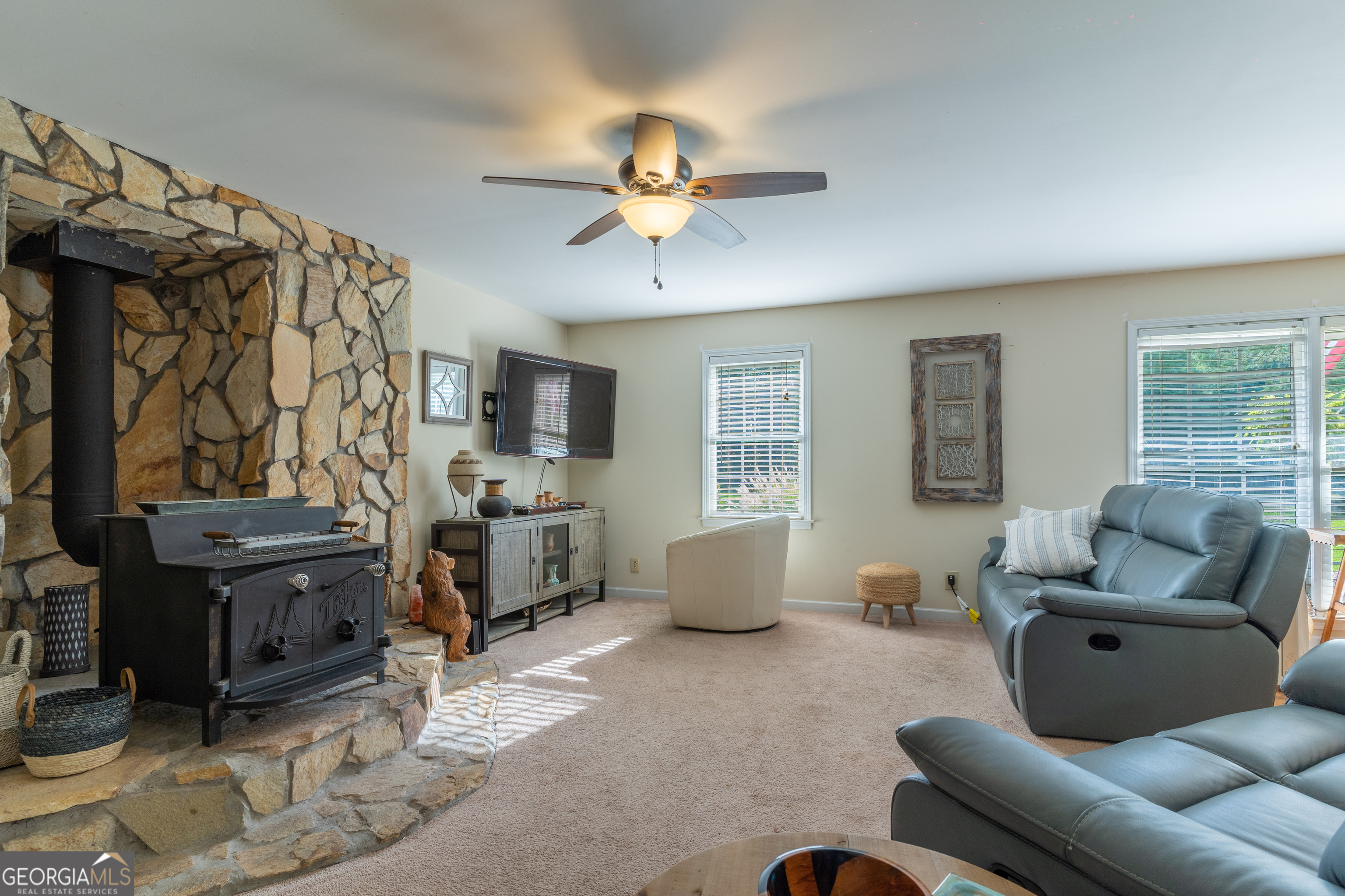 1537 Jackson Street Locust Grove, GA 30248 - Photo 14 of 41 a living room with furniture and a flat screen tv