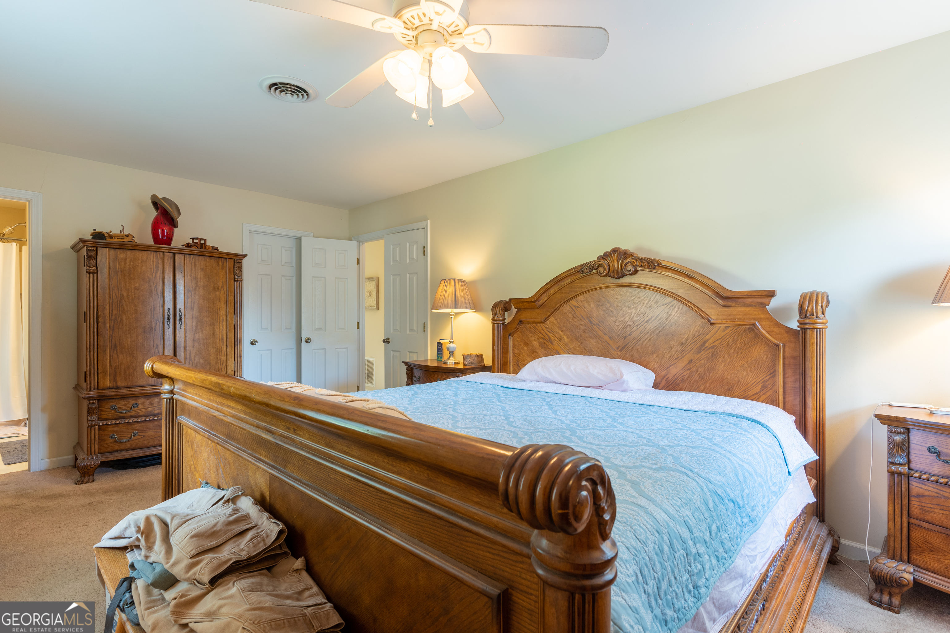 1537 Jackson Street Locust Grove, GA 30248 - Photo 21 of 41 a bedroom with a bed and a chandelier