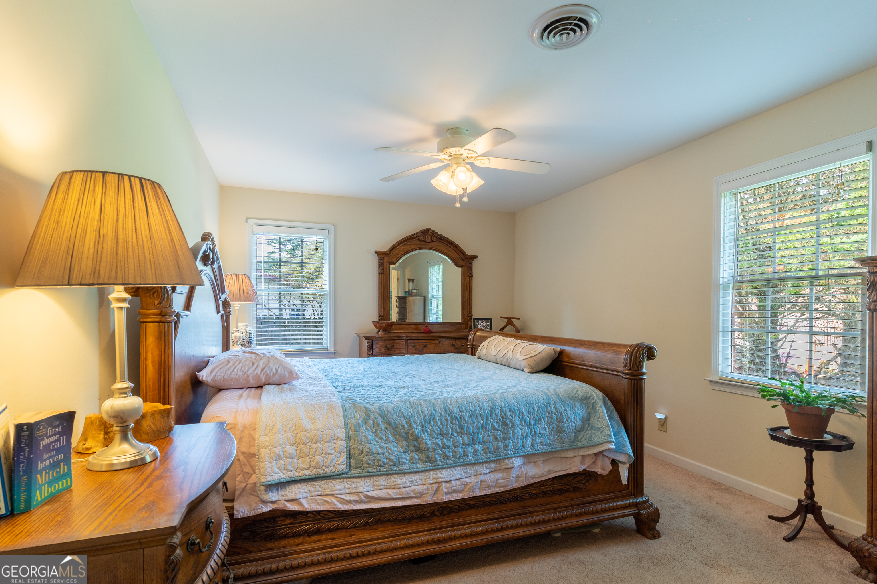 1537 Jackson Street Locust Grove, GA 30248 - Photo 22 of 41 a bedroom with a bed and a chandelier