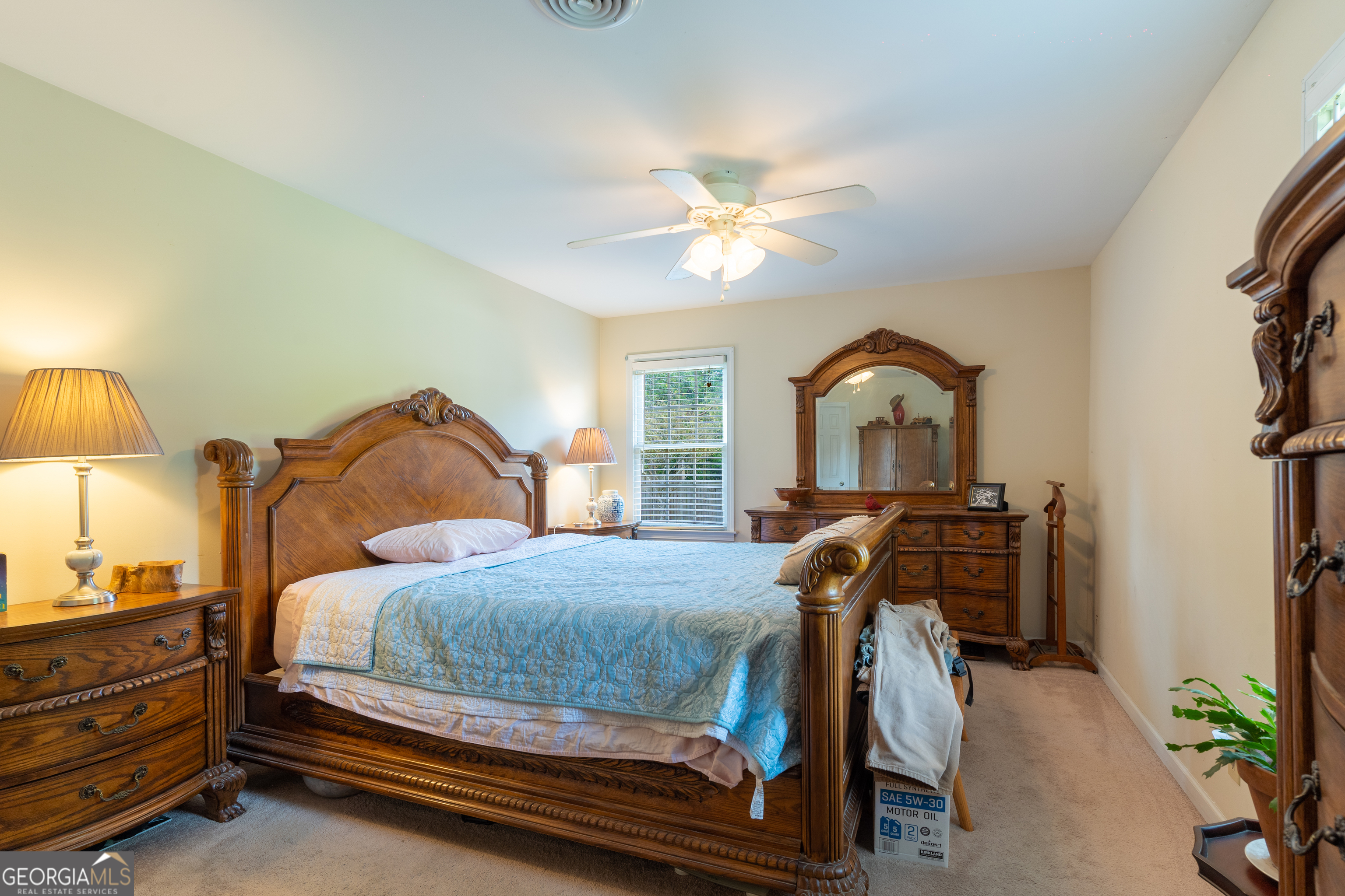 1537 Jackson Street Locust Grove, GA 30248 - Photo 23 of 41 a bedroom with a bed and a chandelier
