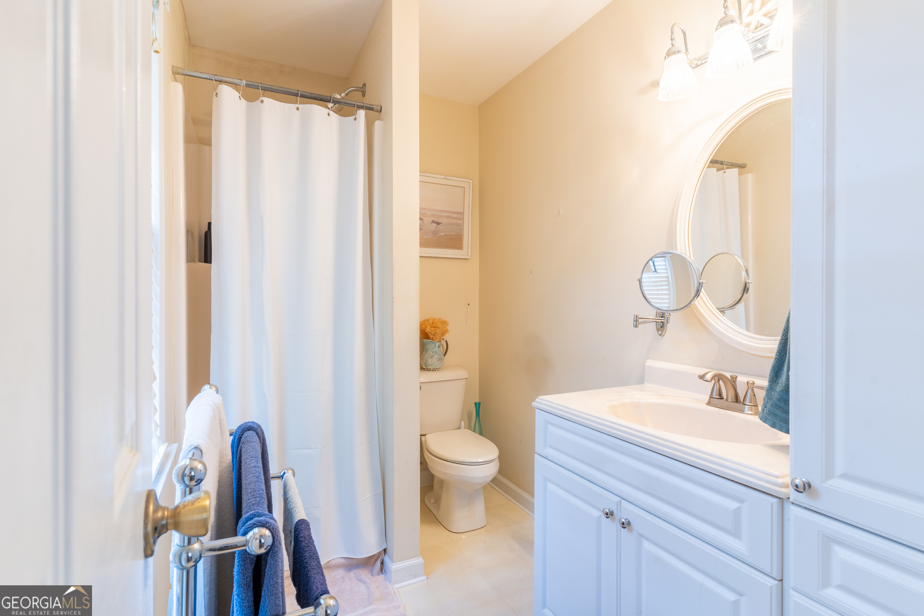 1537 Jackson Street Locust Grove, GA 30248 - Photo 24 of 41 a bathroom with a sink a toilet and a mirror