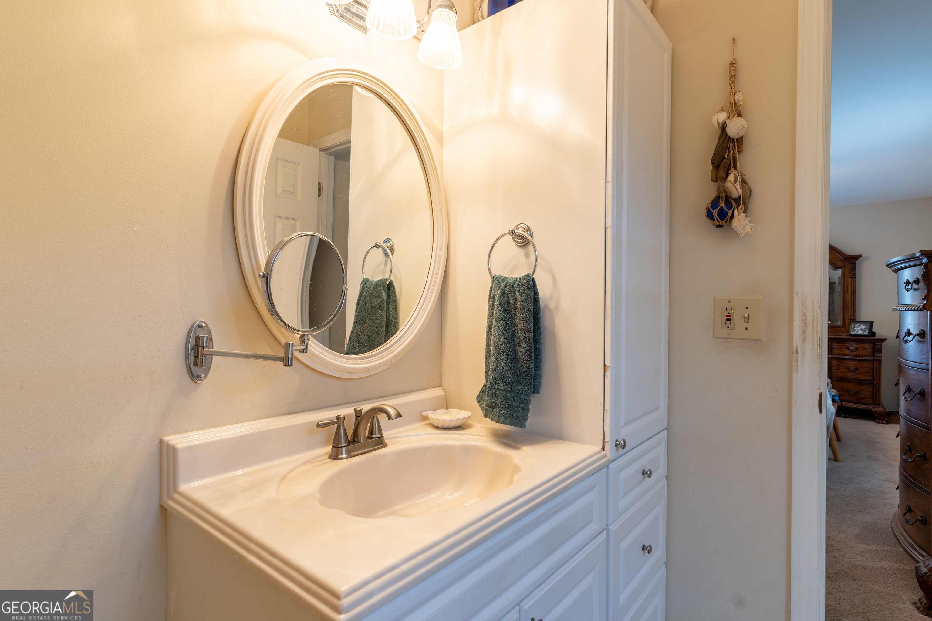 1537 Jackson Street Locust Grove, GA 30248 - Photo 25 of 41 a bathroom with a sink and a mirror