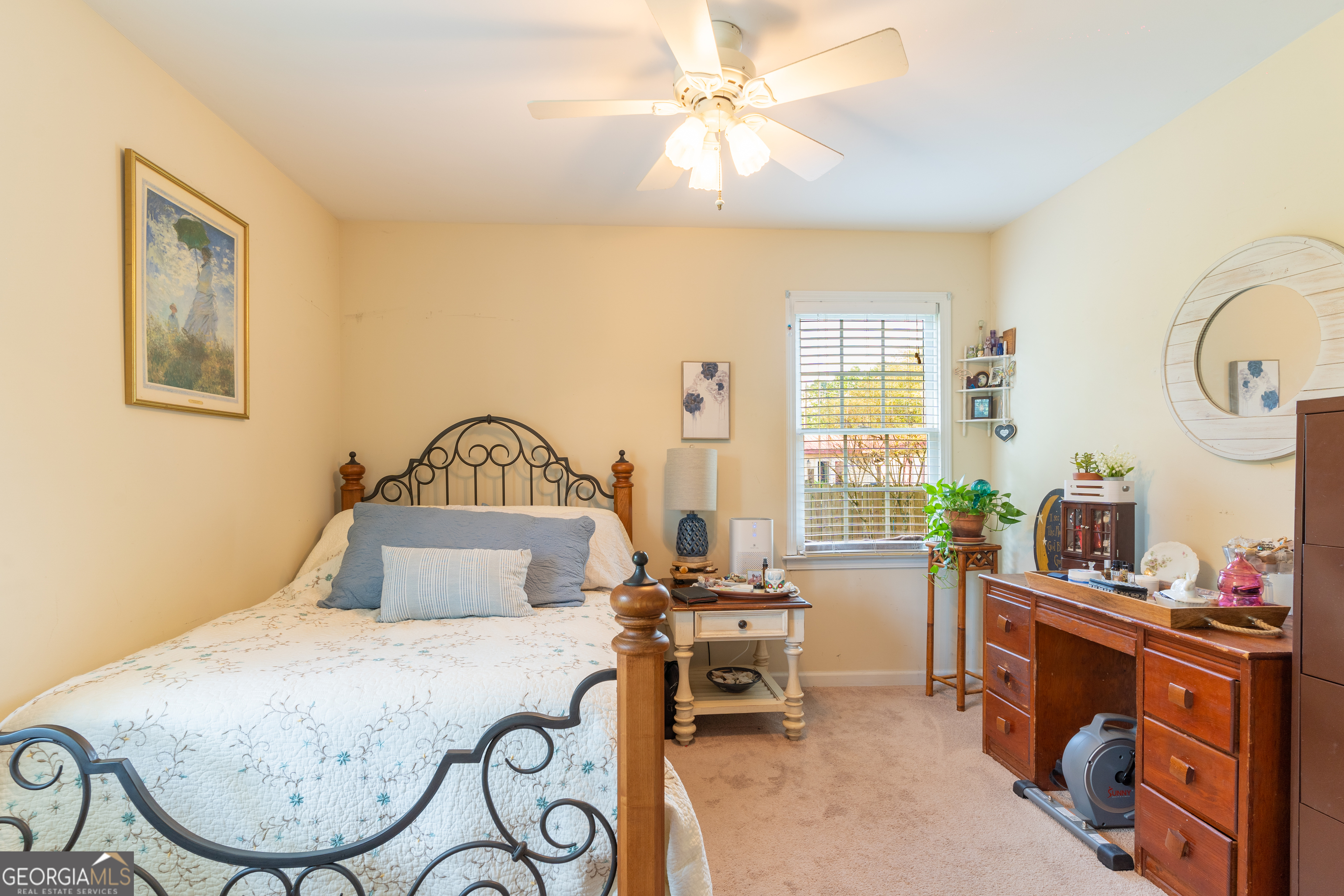 1537 Jackson Street Locust Grove, GA 30248 - Photo 27 of 41 a bedroom with a bed a table and chair with the potted plants