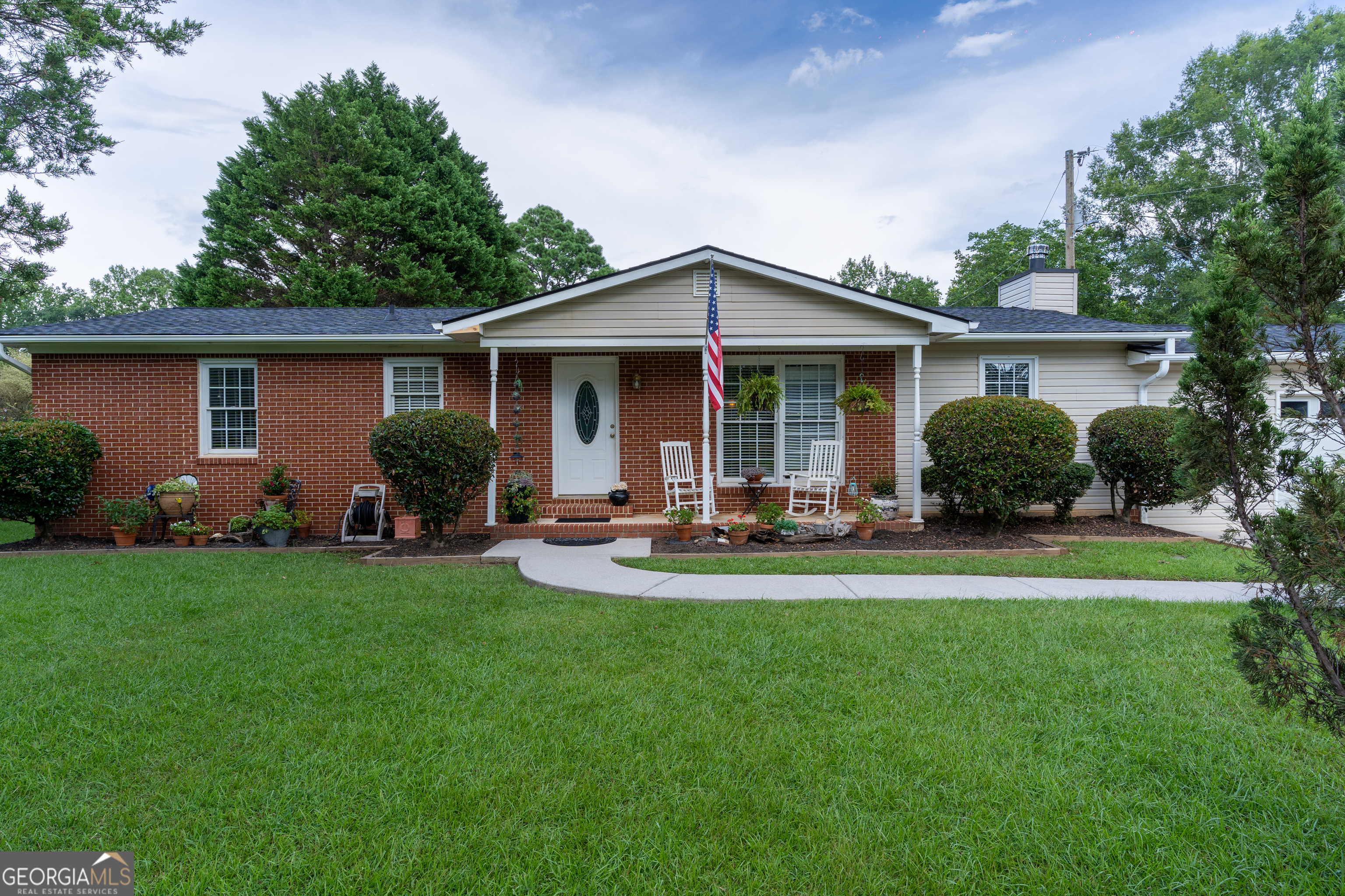 1537 Jackson Street Locust Grove, GA 30248 - Photo 30 of 41 a front view of house with yard and outdoor seating