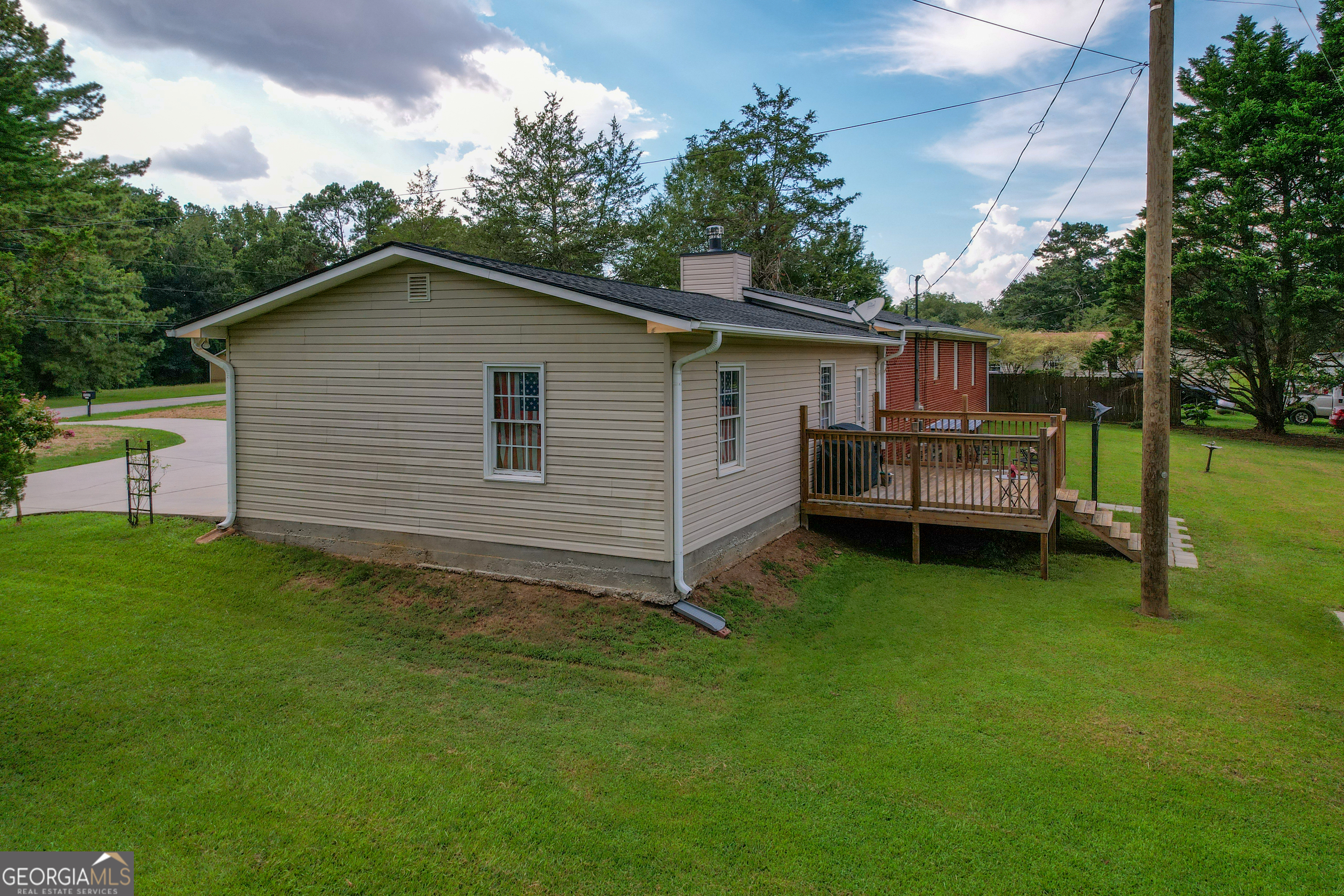 1537 Jackson Street Locust Grove, GA 30248 - Photo 34 of 41 a backyard of a house with barbeque oven and trees