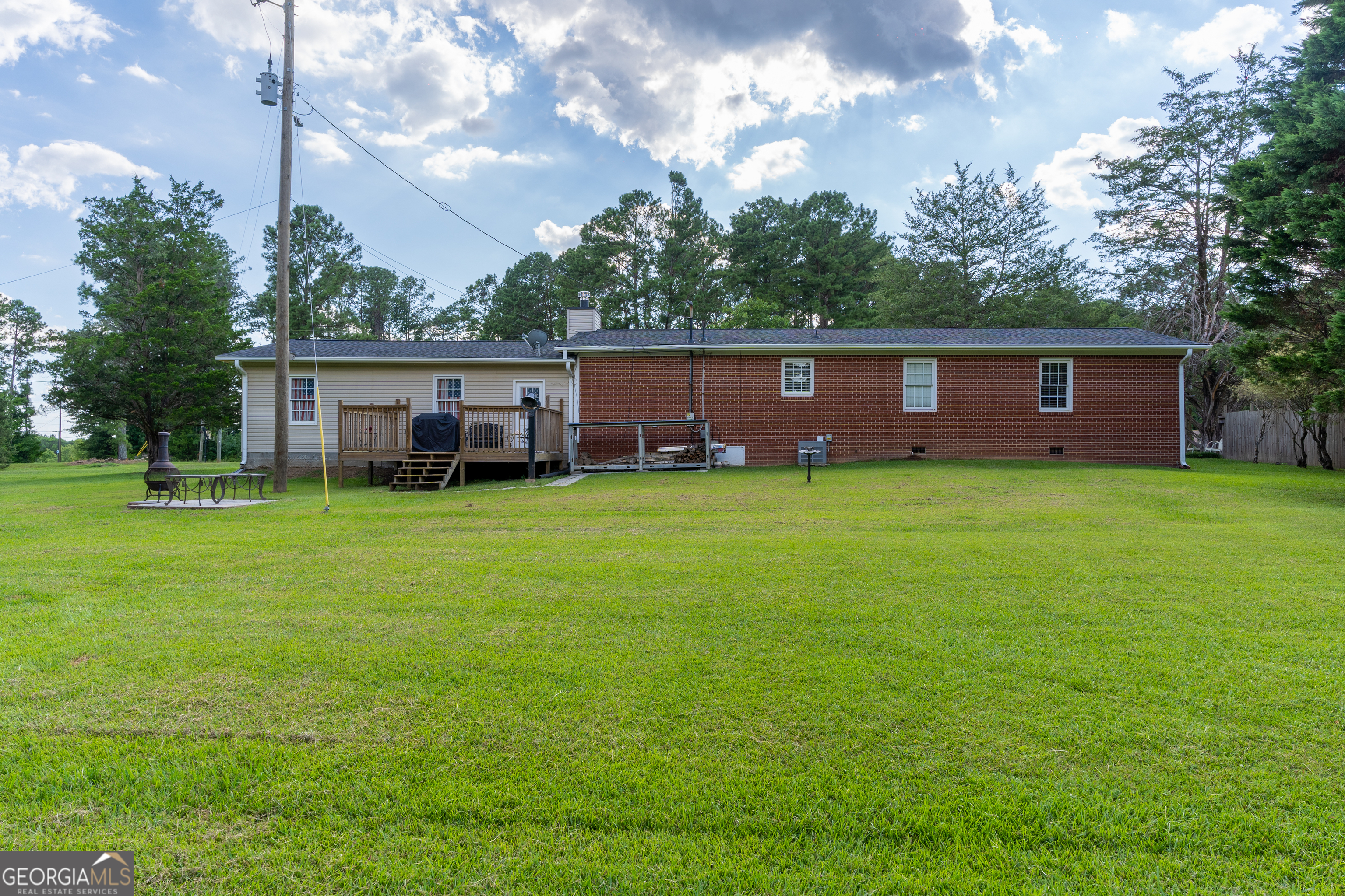 1537 Jackson Street Locust Grove, GA 30248 - Photo 36 of 41 a view of a house with a yard and trees