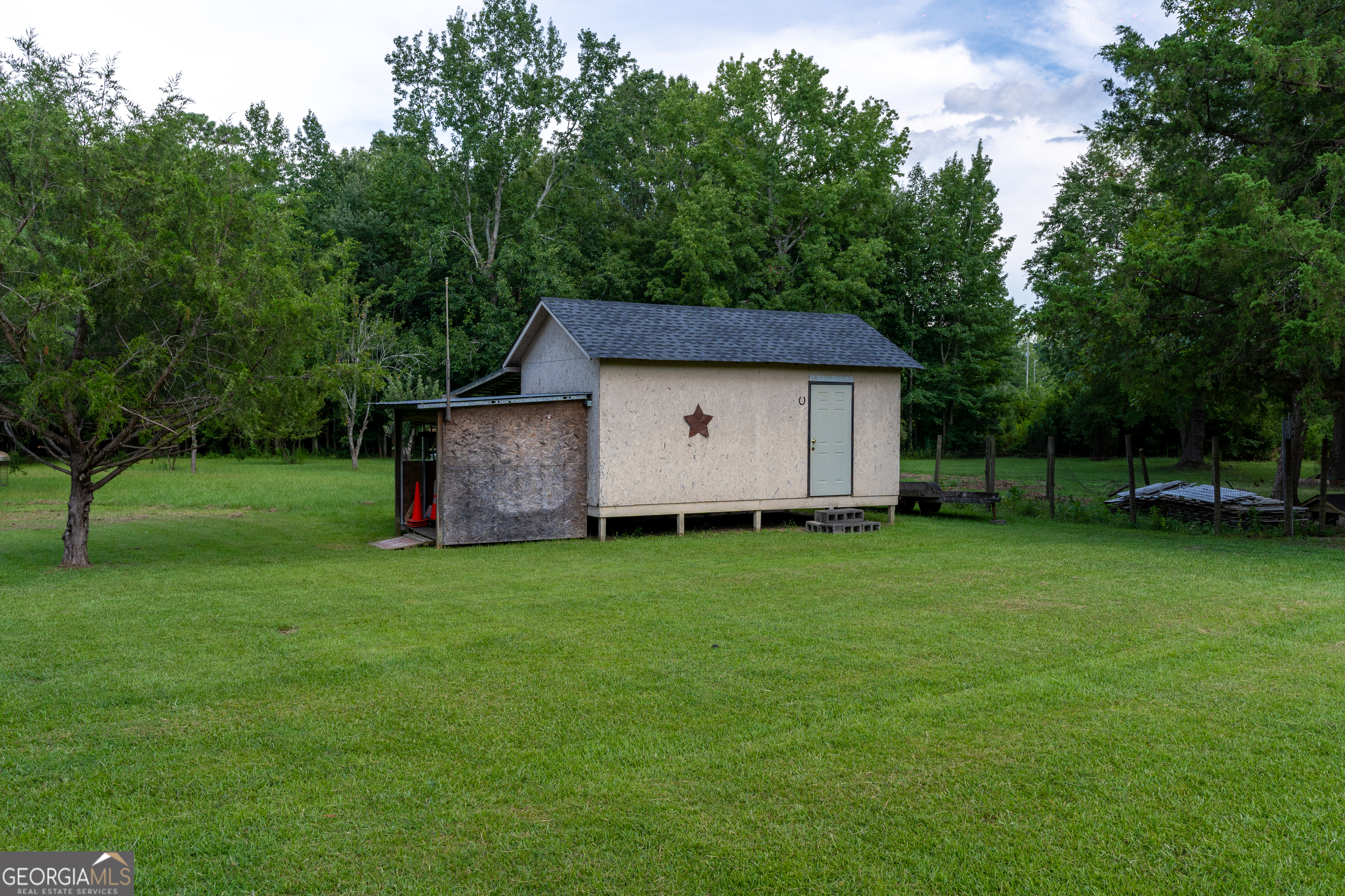 1537 Jackson Street Locust Grove, GA 30248 - Photo 39 of 41 a view of a house with backyard and garden