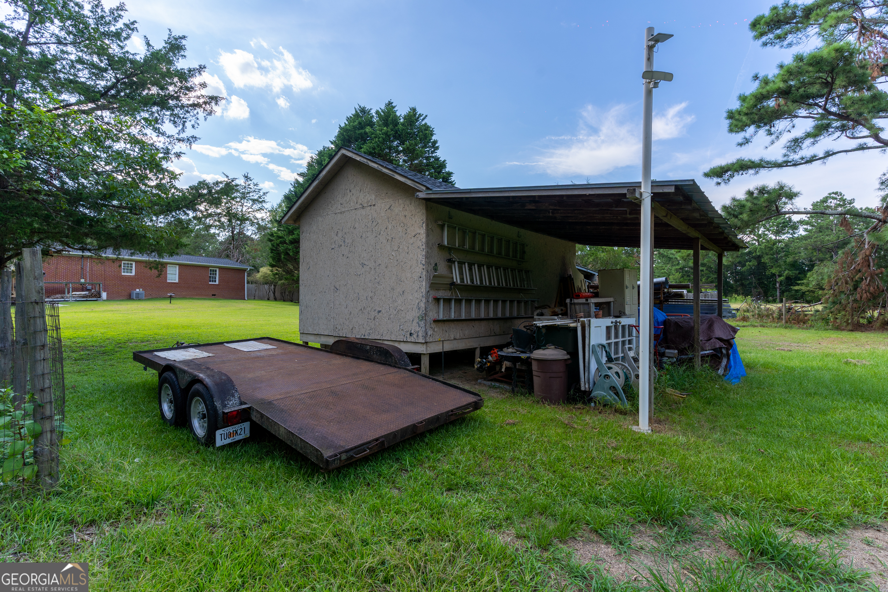 1537 Jackson Street Locust Grove, GA 30248 - Photo 40 of 41 a view of a chair and table in backyard of the house