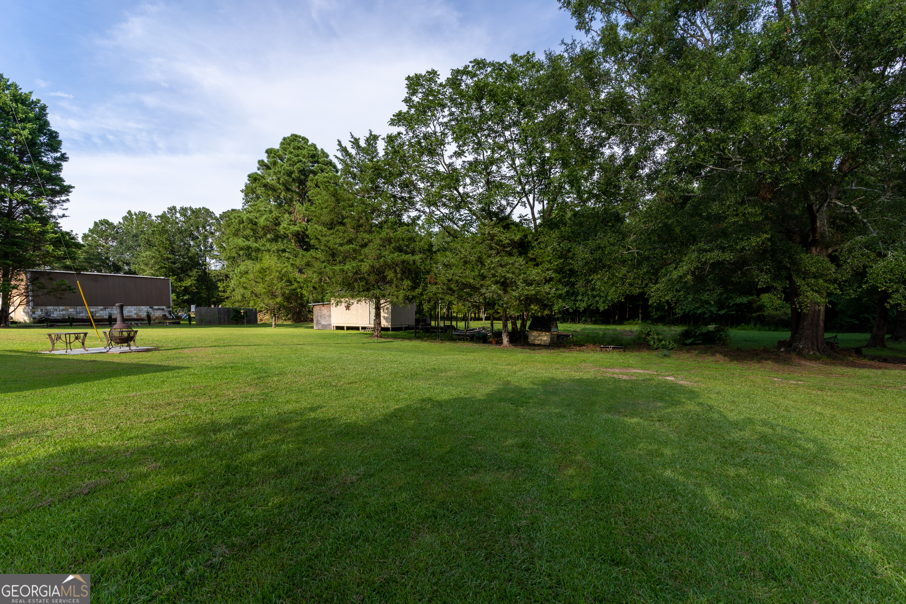 1537 Jackson Street Locust Grove, GA 30248 - Photo 41 of 41 a view of building with trees in the background