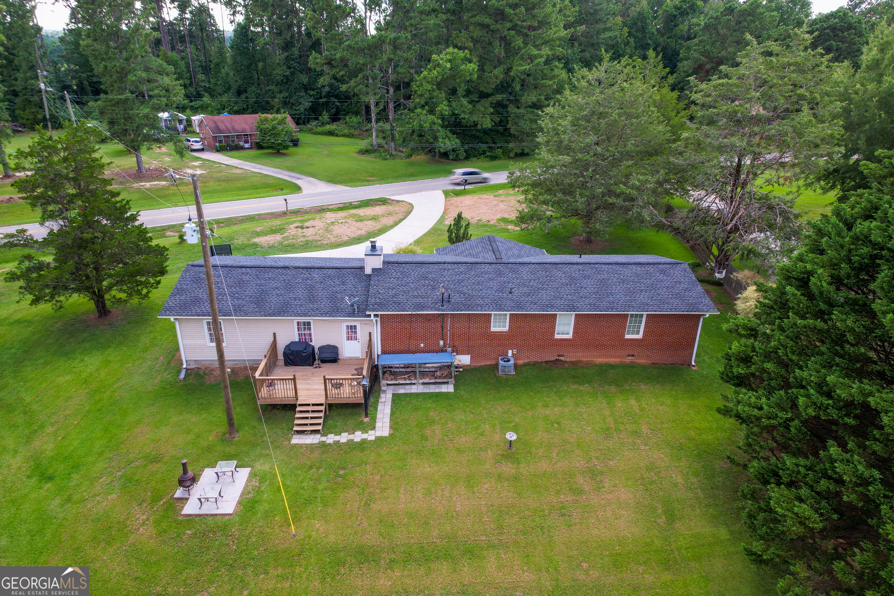 1537 Jackson Street Locust Grove, GA 30248 - Photo 6 of 41 a backyard of a house with table and chairs