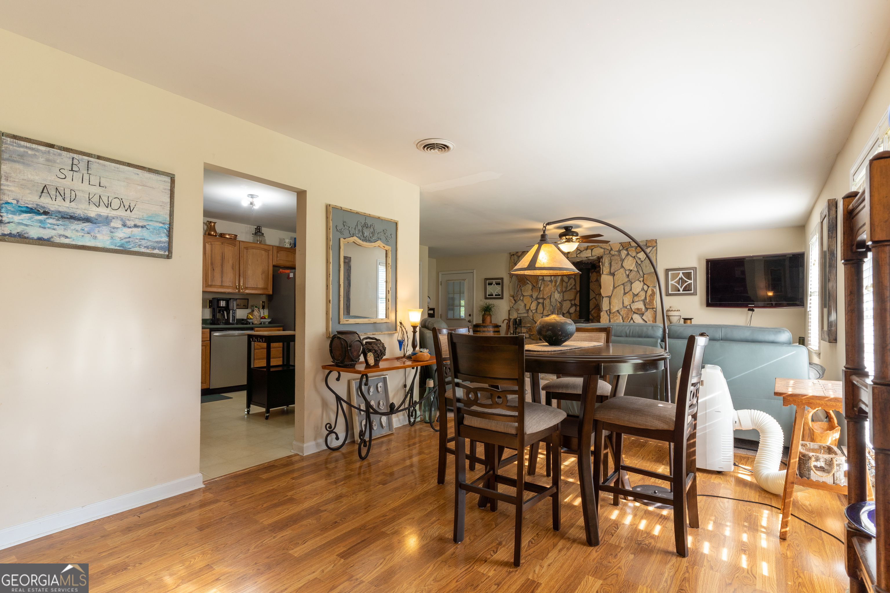 1537 Jackson Street Locust Grove, GA 30248 - Photo 10 of 41 a view of a dining room with furniture and wooden floor
