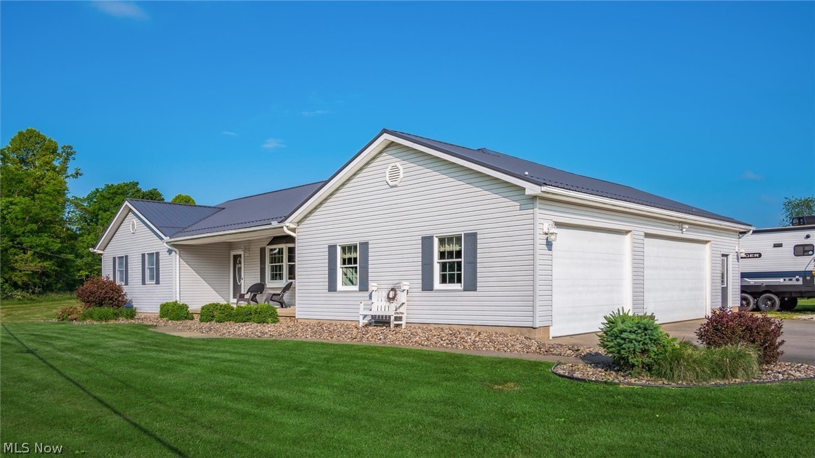 9393 Pioneer Road Byesville, OH 43723 - Photo 3 of 35 Single story home featuring a front lawn and a garage