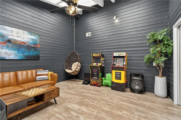 a sitting area with furniture and a potted plant