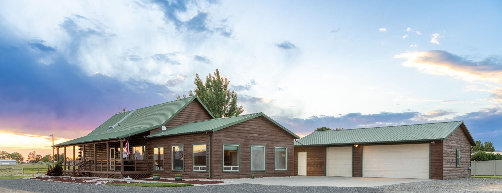 1213 Signal Rock Road Grand Junction, CO 81505 - Photo 1 of 20 a front view of a house with garden