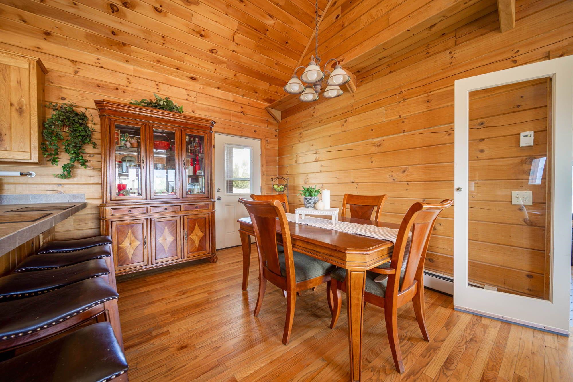 1213 Signal Rock Road Grand Junction, CO 81505 - Photo 11 of 20 a view of a dining room with furniture window and wooden floor