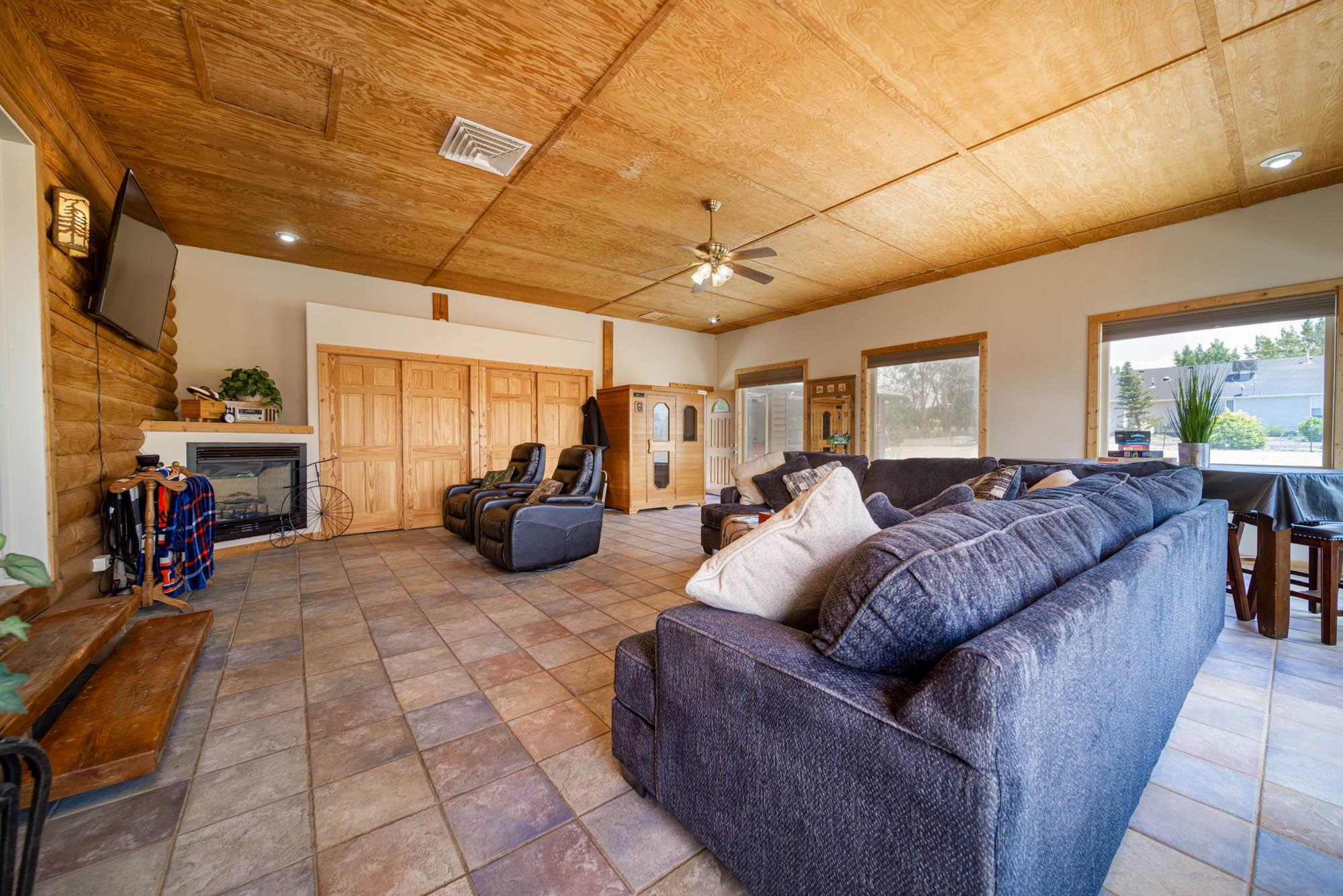 1213 Signal Rock Road Grand Junction, CO 81505 - Photo 16 of 20 a living room with furniture a couch and a window
