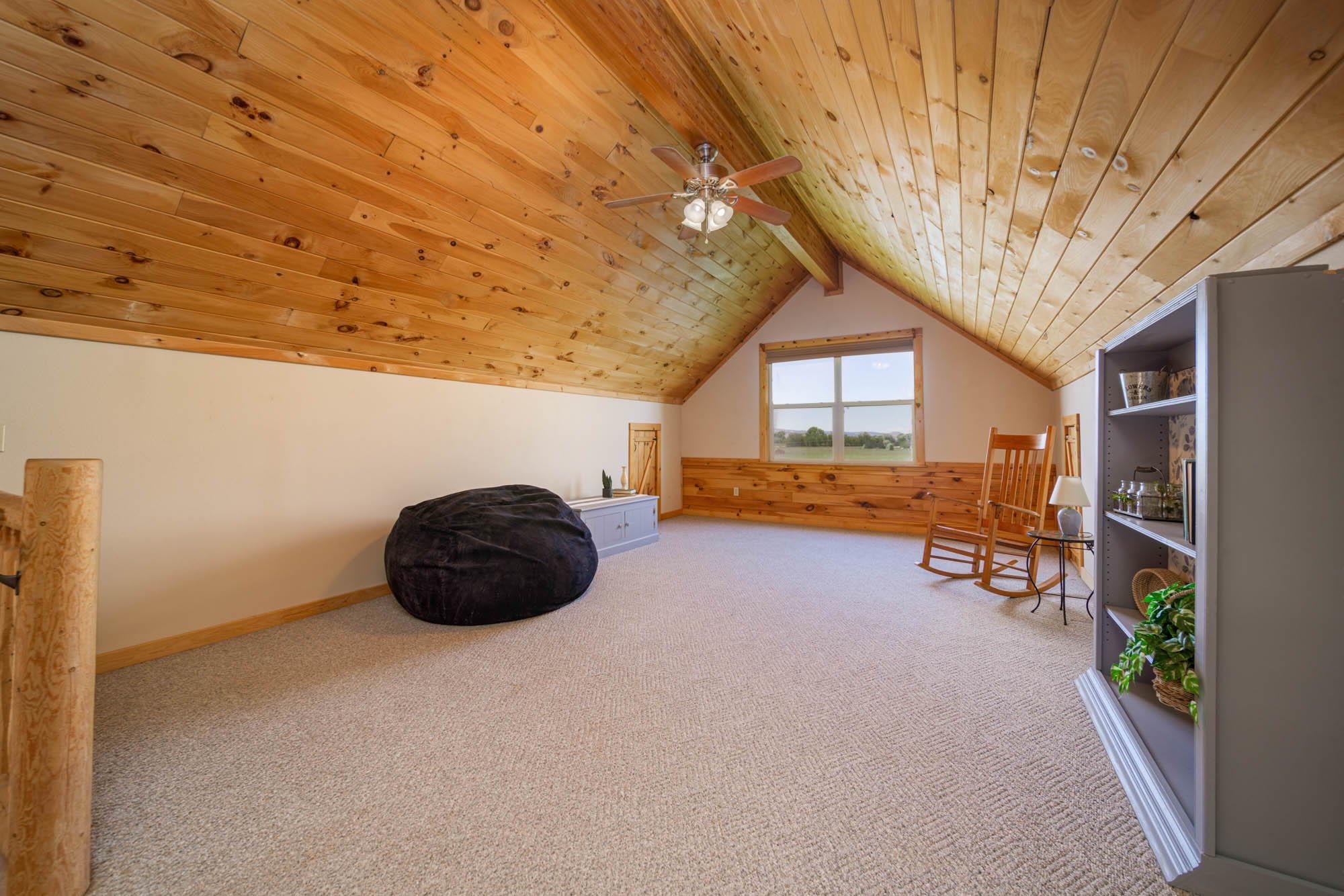 1213 Signal Rock Road Grand Junction, CO 81505 - Photo 17 of 20 a bedroom with furniture and a window