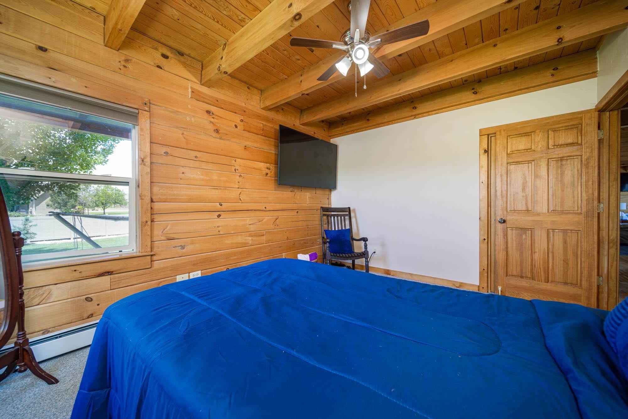 1213 Signal Rock Road Grand Junction, CO 81505 - Photo 19 of 20 a view of empty room with wooden floor and fan