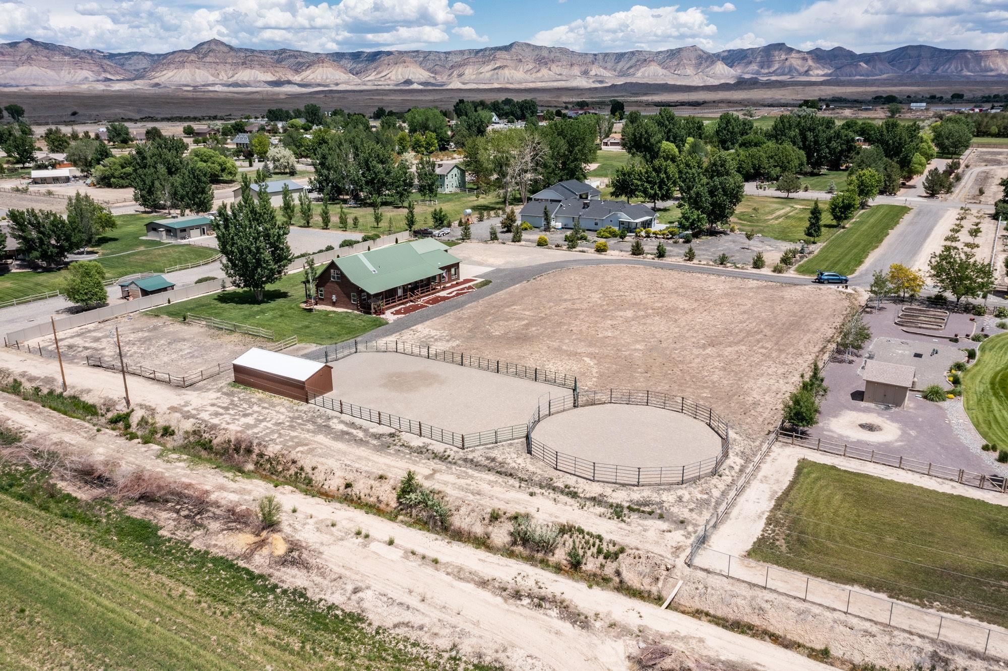1213 Signal Rock Road Grand Junction, CO 81505 - Photo 3 of 20 an aerial view of a house with a yard and lake view