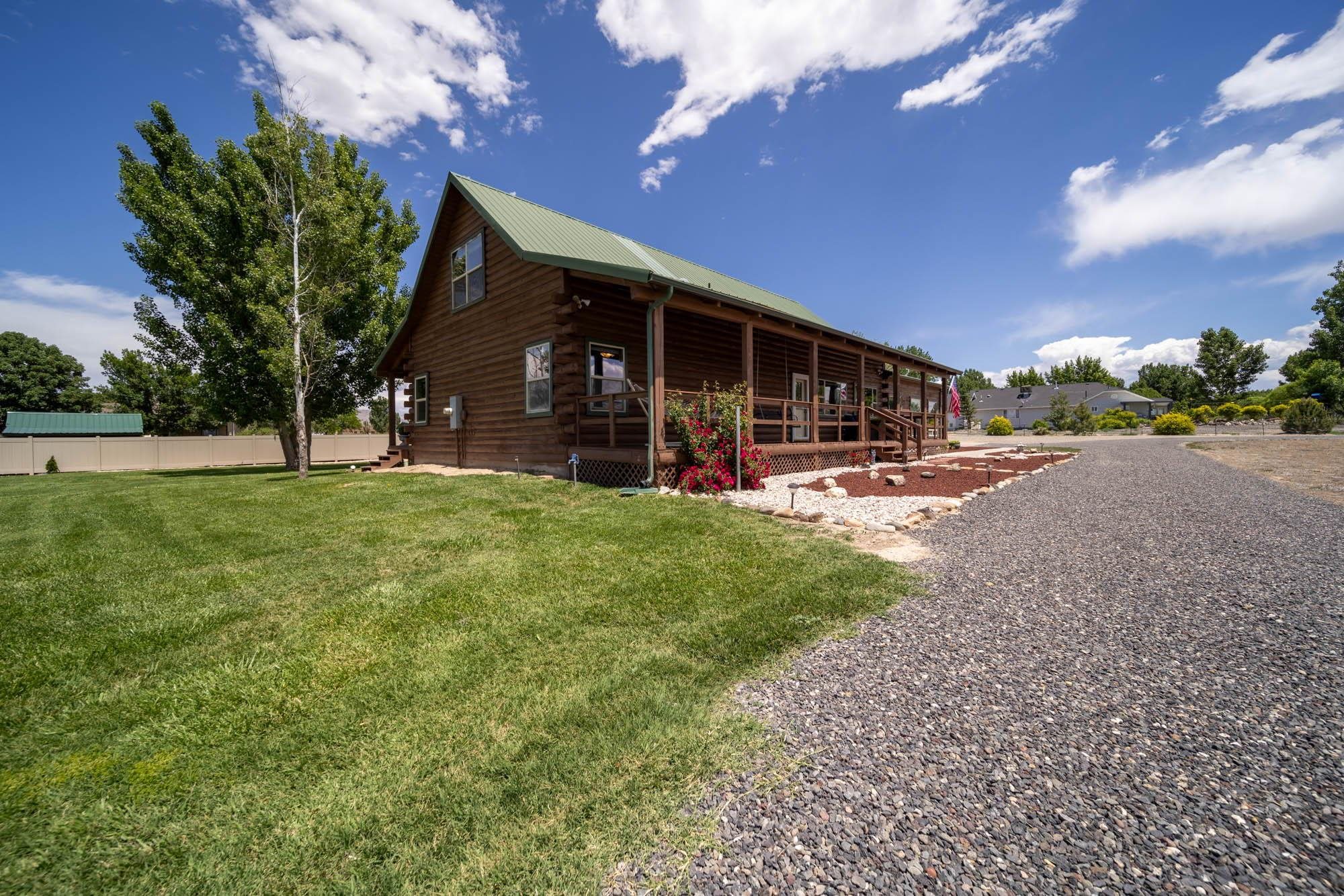 1213 Signal Rock Road Grand Junction, CO 81505 - Photo 6 of 20 a view of a house with a yard porch and sitting area
