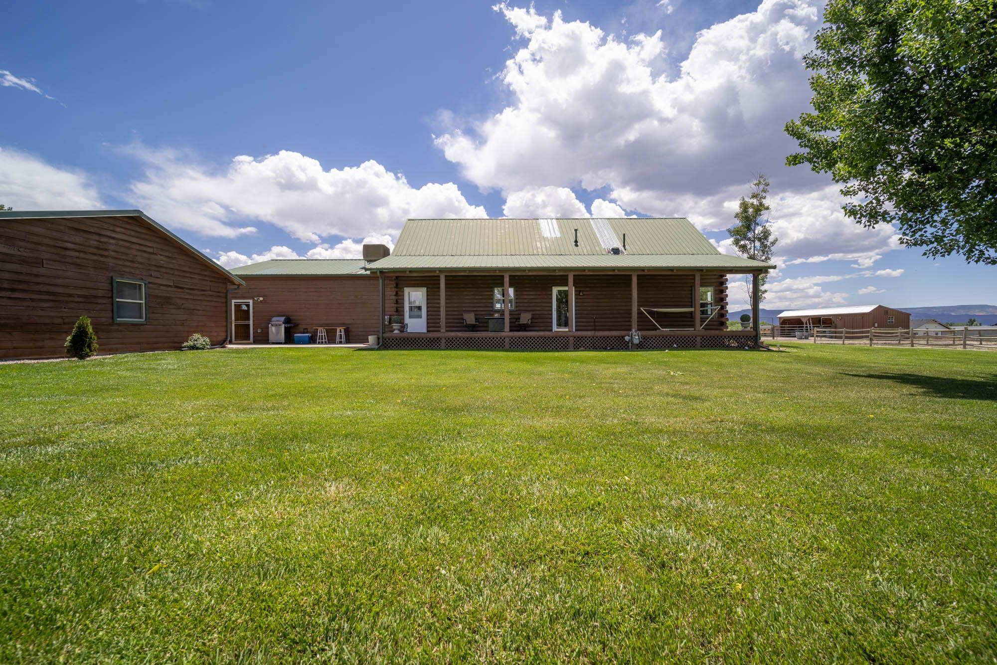 1213 Signal Rock Road Grand Junction, CO 81505 - Photo 7 of 20 a view of a house with a yard and sitting area