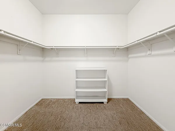 a view of an empty walk in closet