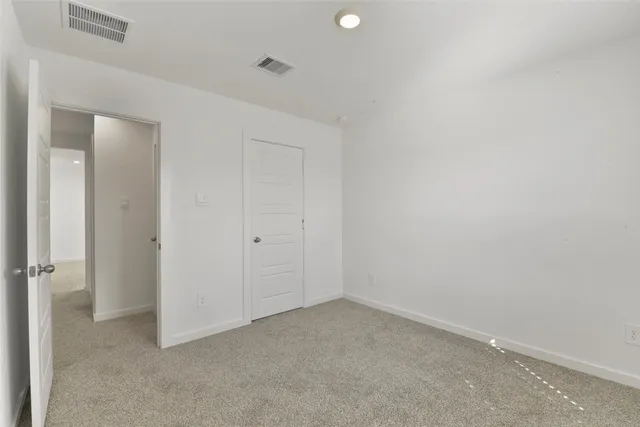 a view of a room with a big yard and potted plants