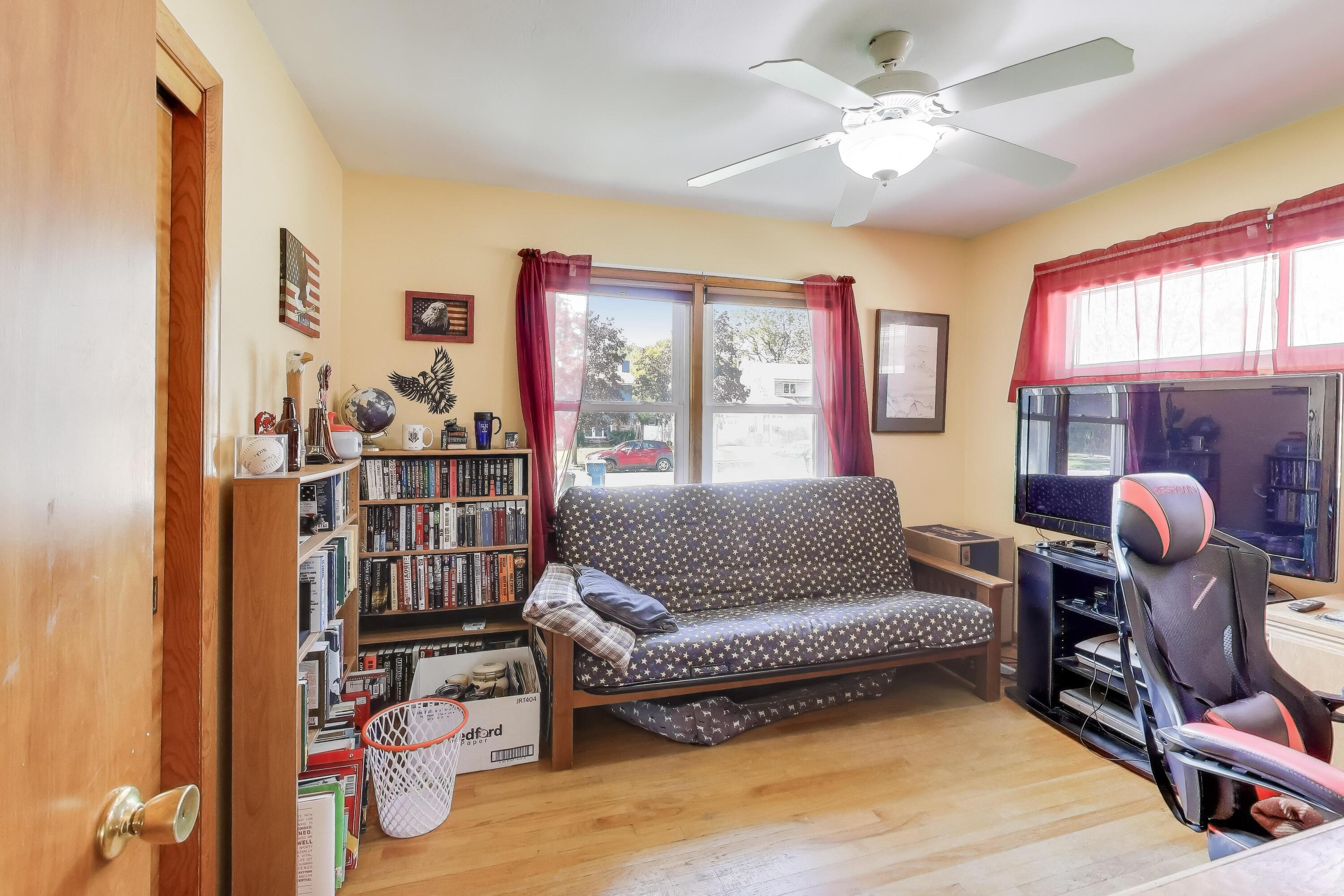 1343 Harvey Street Griffith, IN 46319 - Photo 14 of 31 a living room with furniture and a floor to ceiling window