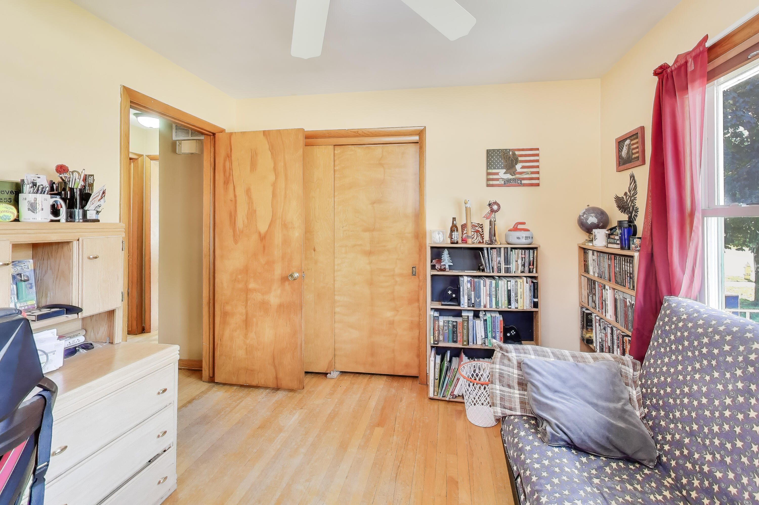 1343 Harvey Street Griffith, IN 46319 - Photo 15 of 31 a bed room with a bed and a book shelf