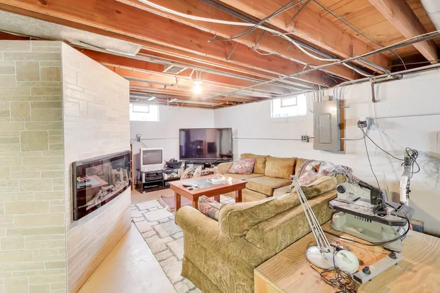 a living room with furniture and a fireplace