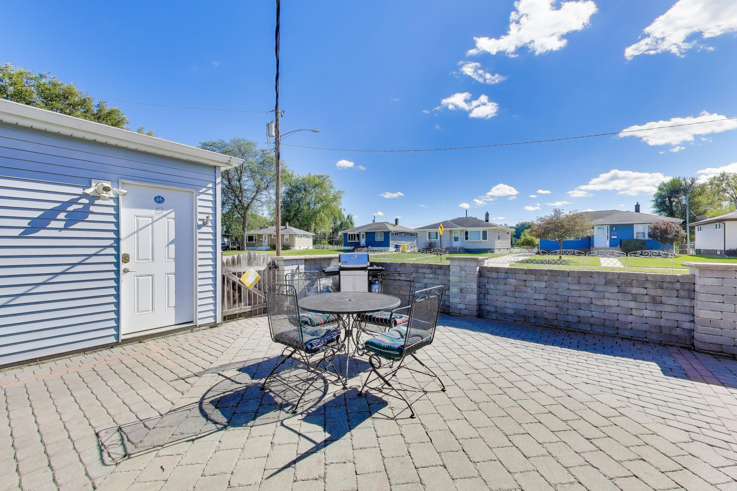 1343 Harvey Street Griffith, IN 46319 - Photo 27 of 31 a living room with patio furniture and a potted plant