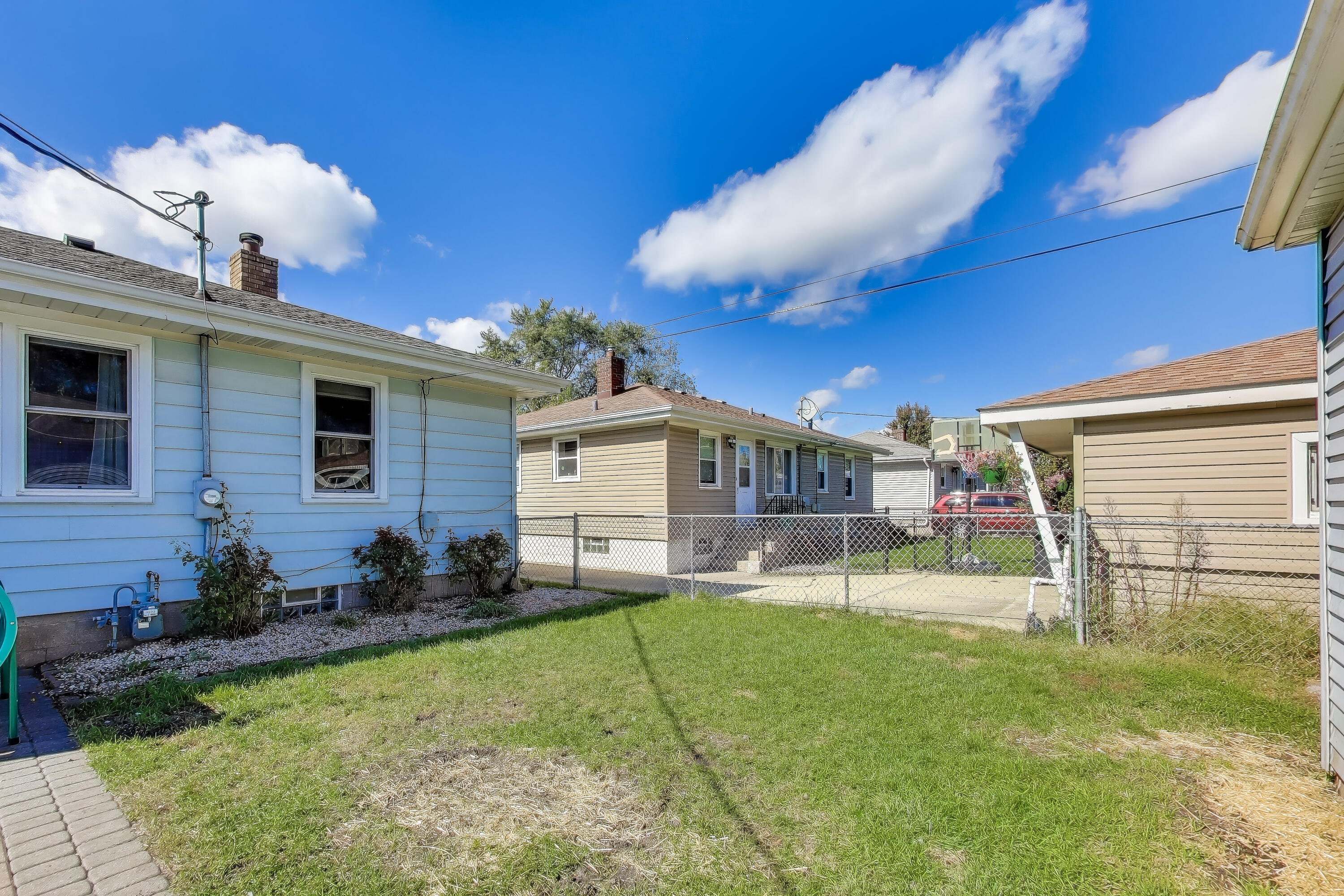 1343 Harvey Street Griffith, IN 46319 - Photo 30 of 31 a view of a chair and table in backyard