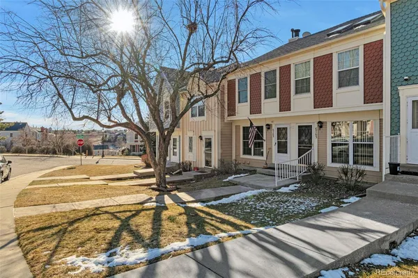 a view of a house with snow on the side of it