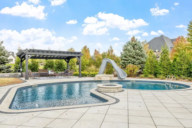 a view of swimming pool from a lounge chair